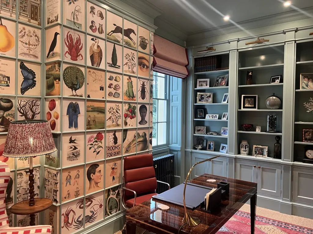 The illustrated bookcase from the other side of the study, shelves holding photographs and small objects.